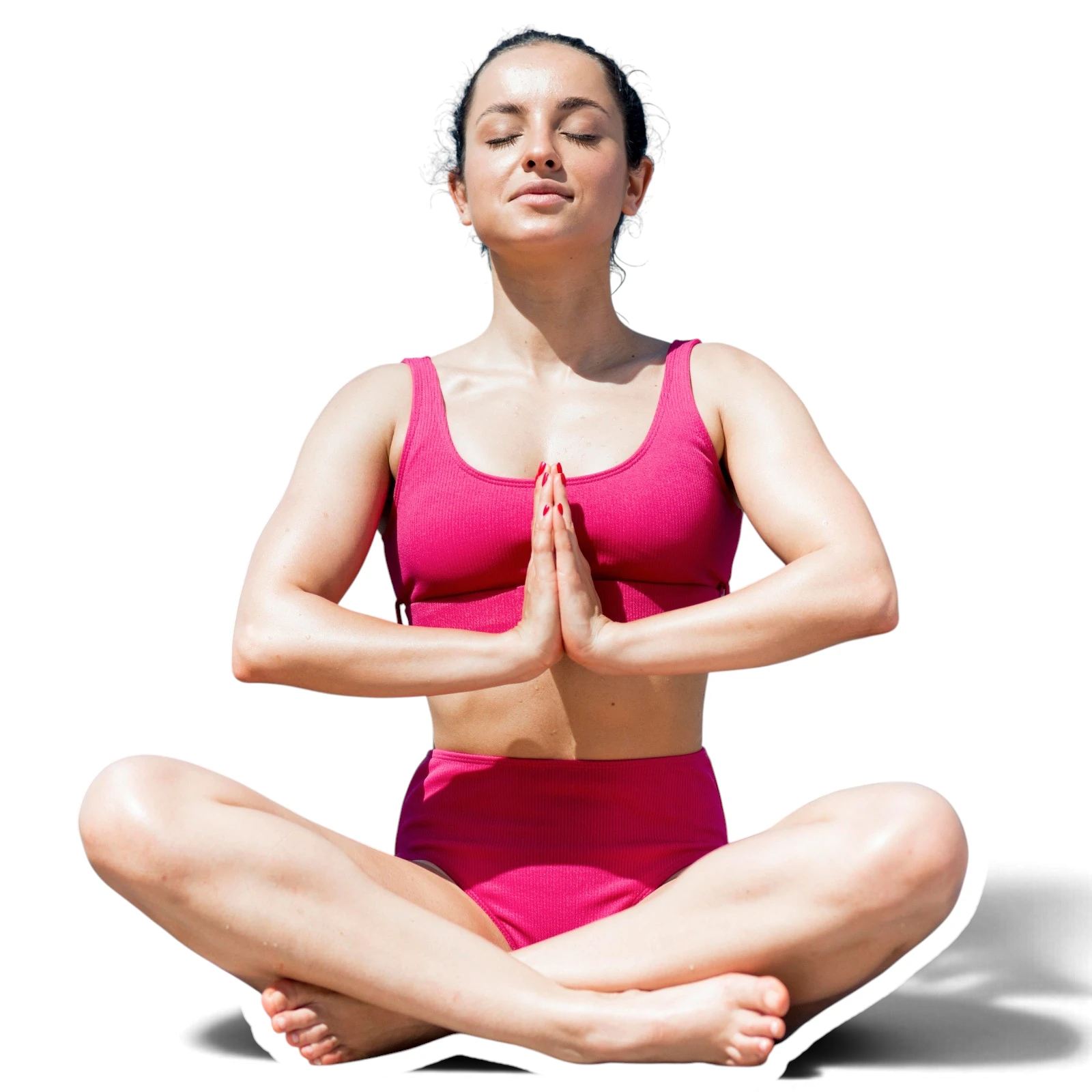 Woman sitting cross legged with her palms together, taking a slow breathing break